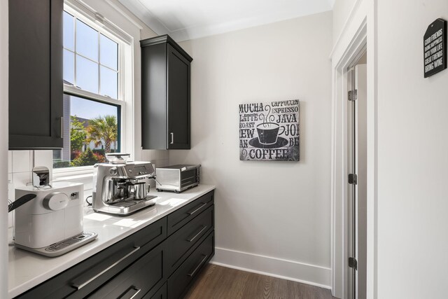 1234 Captain Rivers Dr, Charleston, SC 29412 - kitchen featuring dark wood-type flooring, light countertops, baseboards, and dark cabinets