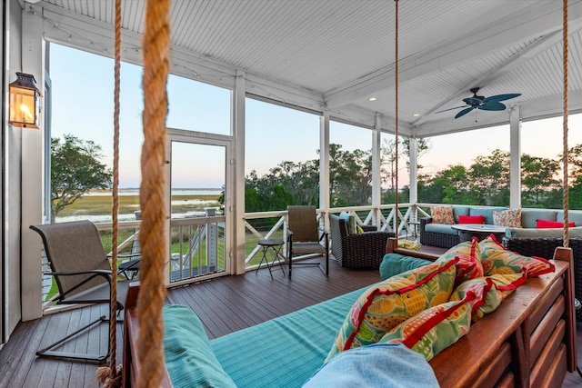 sunroom / solarium with a healthy amount of sunlight and a ceiling fan