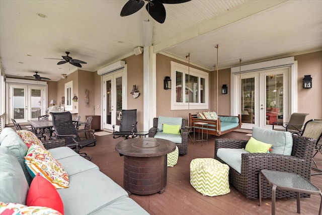 view of patio / terrace featuring french doors, outdoor lounge area, and a deck