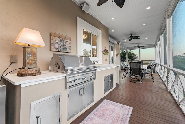 sunroom / solarium featuring a sink