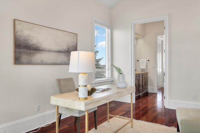 home office featuring baseboards and wood finished floors