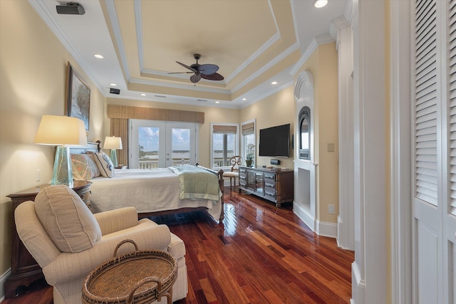 bedroom with recessed lighting, wood finished floors, access to outside, french doors, and a raised ceiling