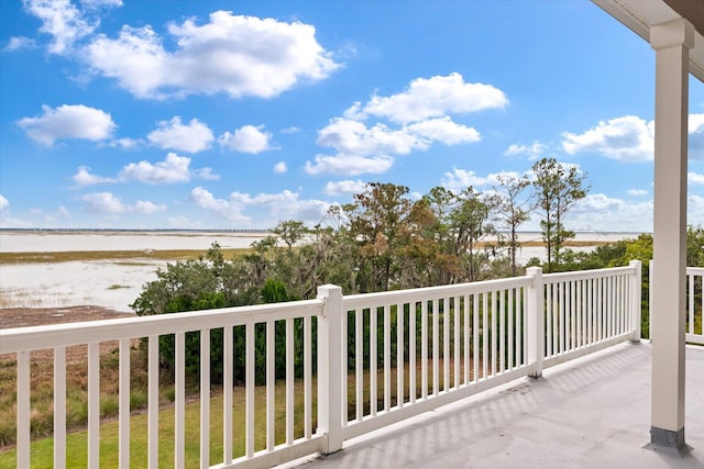 balcony featuring a water view