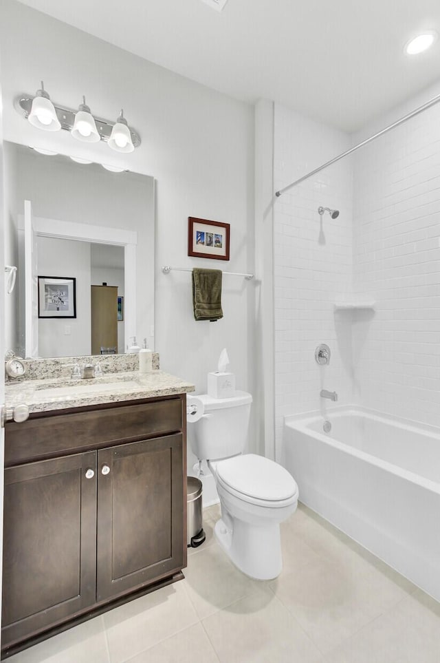 full bath with tile patterned flooring, shower / tub combination, toilet, and vanity