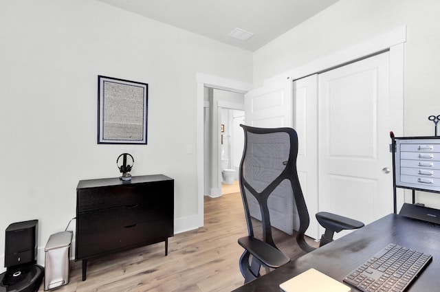 office with baseboards and light wood finished floors