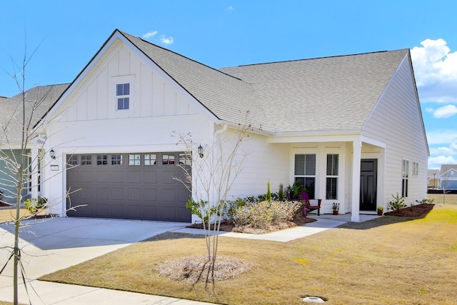 modern inspired farmhouse with driveway, a shingled roof, and a front lawn