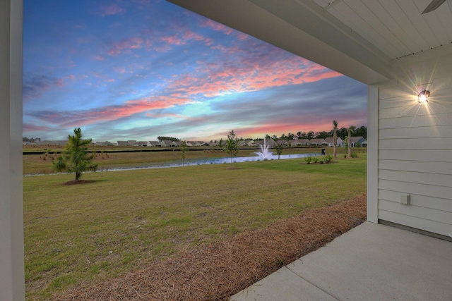 view of yard with a water view