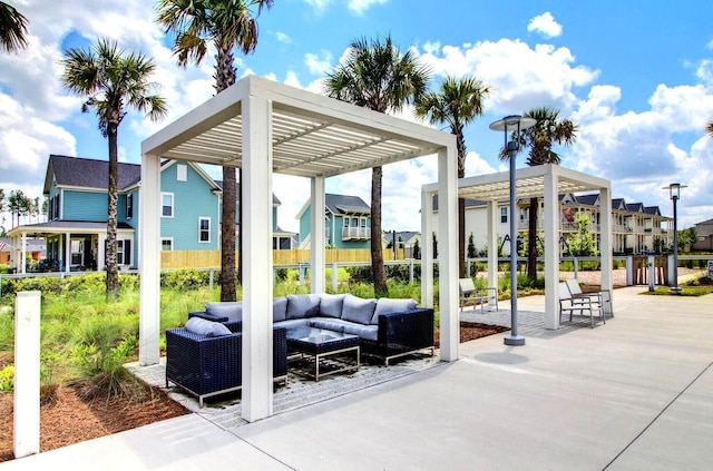 view of patio / terrace with a residential view, outdoor lounge area, and a pergola