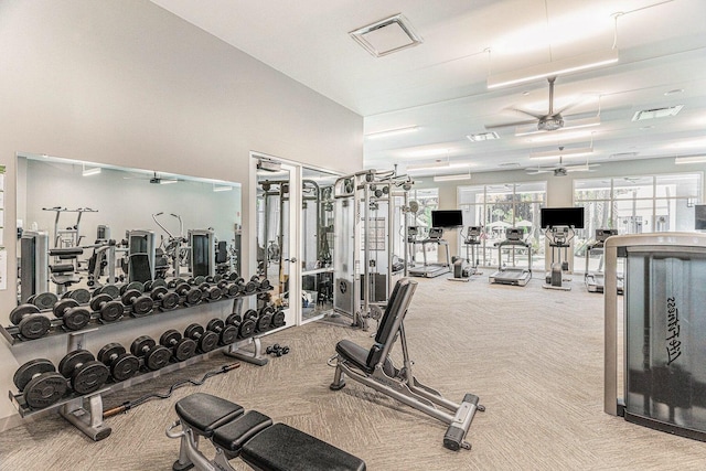 gym featuring visible vents, ceiling fan, and carpet flooring