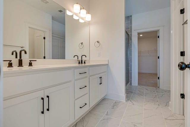 full bath featuring visible vents, baseboards, double vanity, a stall shower, and marble finish floor