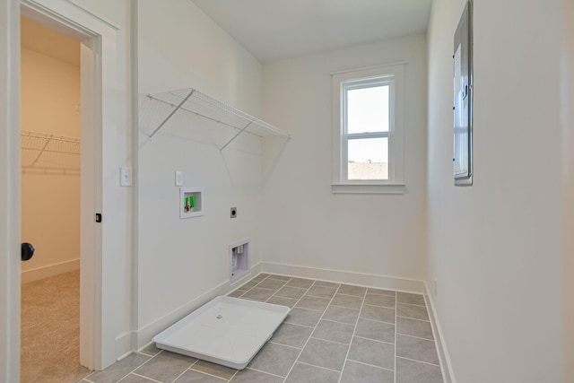 laundry area with baseboards, hookup for an electric dryer, washer hookup, and laundry area