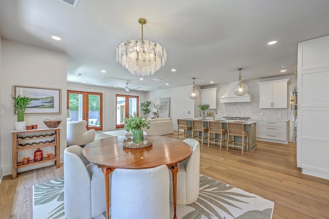 974 Cliffwood Dr, Mount Pleasant, SC 29464 - dining area with recessed lighting, light wood-style flooring, a chandelier, and ceiling fan