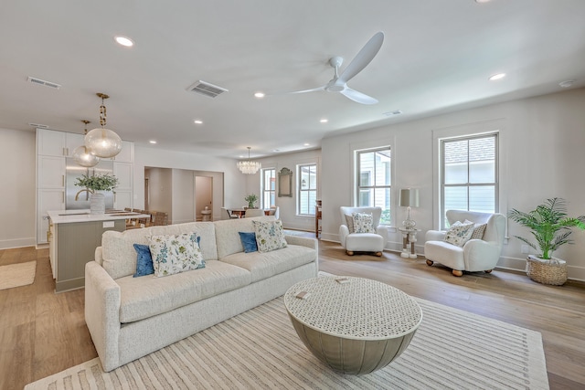 974 Cliffwood Dr, Mount Pleasant, SC 29464 - living area featuring light wood-style floors, ceiling fan, baseboards, and recessed lighting