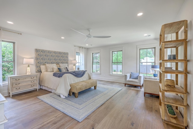 974 Cliffwood Dr, Mount Pleasant, SC 29464 - bedroom featuring multiple windows, wood finished floors, recessed lighting, baseboards, and a ceiling fan