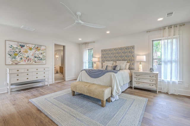 974 Cliffwood Dr, Mount Pleasant, SC 29464 - bedroom with multiple windows, wood finished floors, recessed lighting, ceiling fan, and baseboards