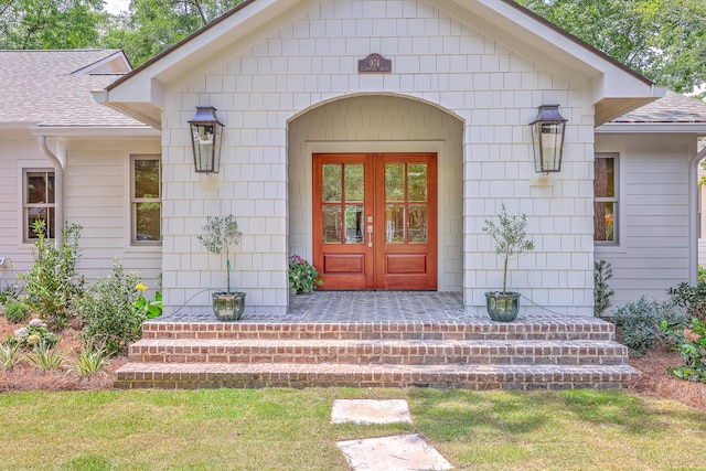 974 Cliffwood Dr, Mount Pleasant, SC 29464 - view of exterior entry featuring a shingled roof and french doors