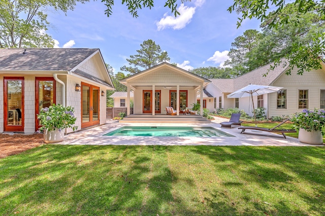 974 Cliffwood Dr, Mount Pleasant, SC 29464 - back of property featuring french doors, an exterior structure, a patio, and an outdoor pool