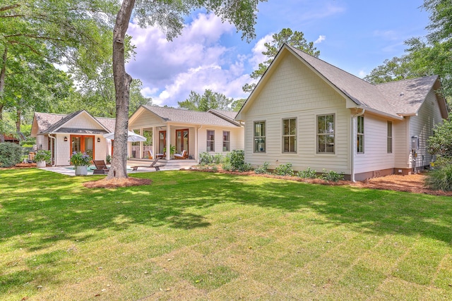 974 Cliffwood Dr, Mount Pleasant, SC 29464 - rear view of house featuring a lawn, a patio area, and a shingled roof