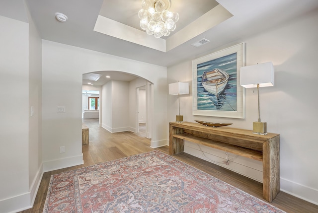 974 Cliffwood Dr, Mount Pleasant, SC 29464 - corridor featuring arched walkways, wood finished floors, a chandelier, baseboards, and recessed lighting