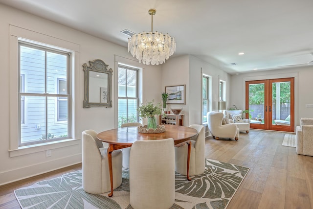 974 Cliffwood Dr, Mount Pleasant, SC 29464 - dining space with a chandelier, wood finished floors, french doors, baseboards, and recessed lighting