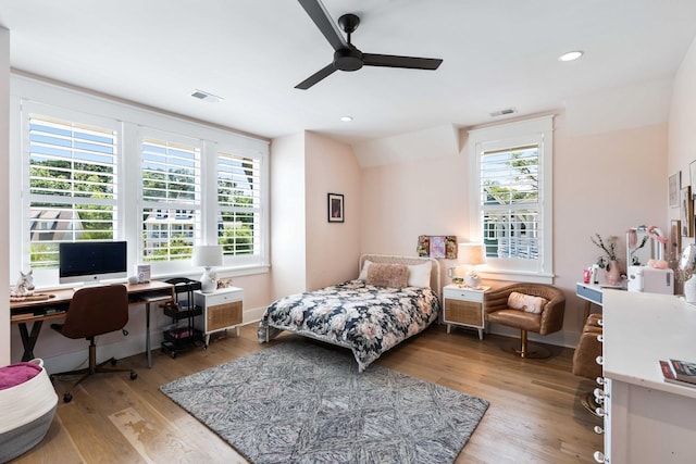 bedroom featuring an office area, light wood finished floors, ceiling fan, and recessed lighting