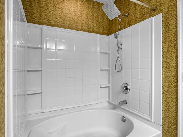 bathroom featuring shower / washtub combination and wallpapered walls