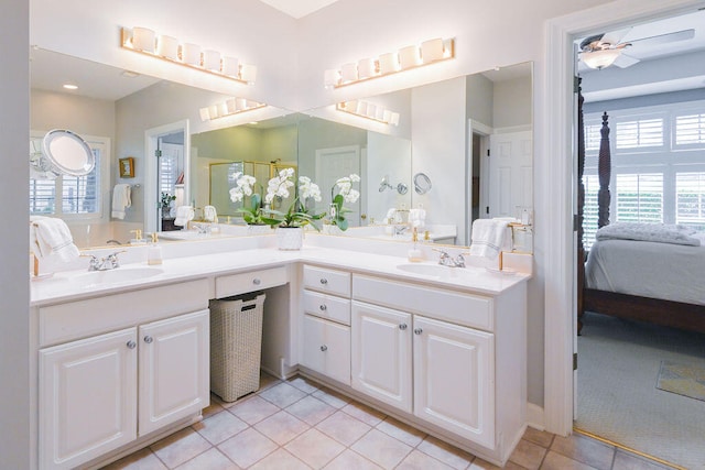 bathroom featuring tile patterned floors, ceiling fan, and vanity