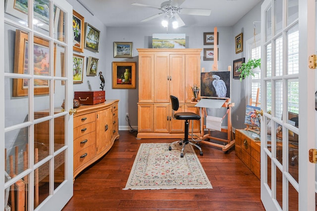 office area featuring a healthy amount of sunlight, dark hardwood / wood-style flooring, ceiling fan, and french doors