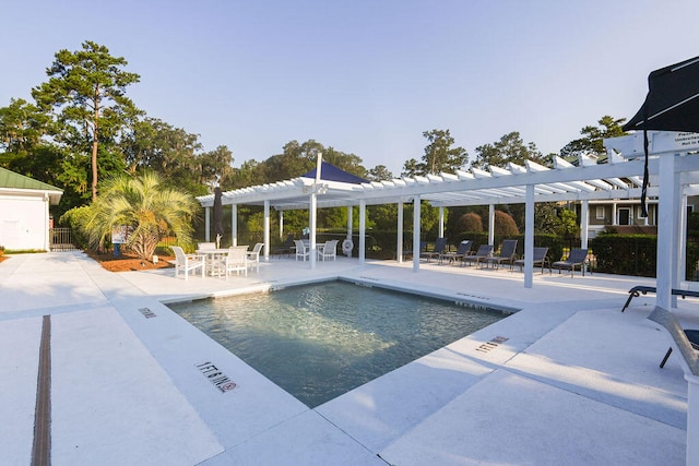 view of pool with a pergola and a patio area