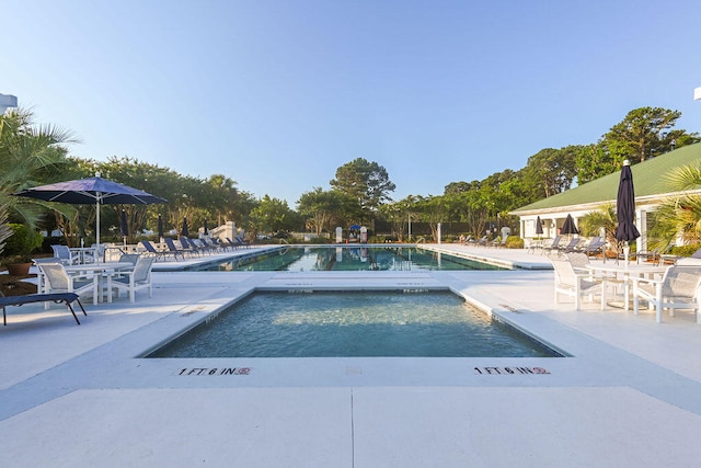 view of swimming pool featuring a patio area