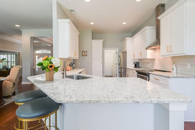 kitchen featuring dark hardwood / wood-style floors, sink, white cabinetry, stainless steel appliances, and backsplash