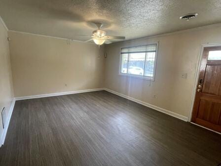 foyer entrance featuring ceiling fan, dark hardwood / wood-style flooring, and a healthy amount of sunlight