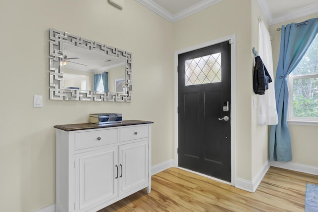 entryway featuring ceiling fan, crown molding, and light hardwood / wood-style flooring