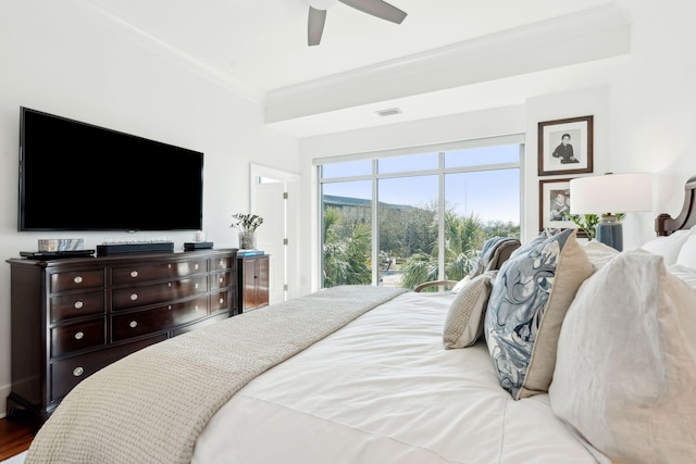 bedroom with wood finished floors, a ceiling fan, visible vents, access to exterior, and ornamental molding