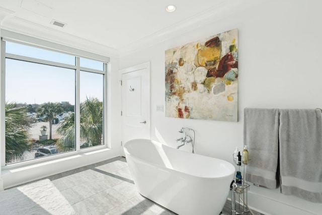 full bathroom with recessed lighting, visible vents, a freestanding bath, ornamental molding, and tile patterned floors