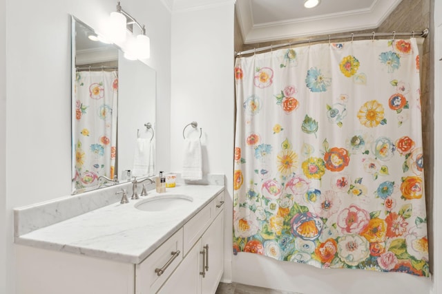 bathroom featuring ornamental molding, shower / tub combo with curtain, and vanity