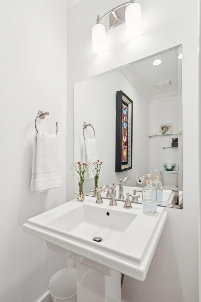 bathroom featuring visible vents and a sink