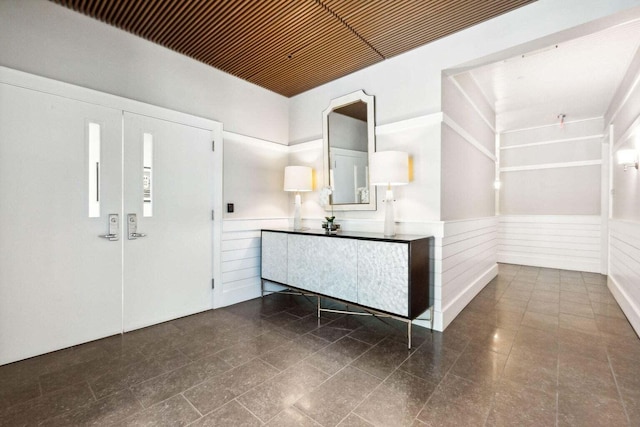 foyer entrance featuring wainscoting