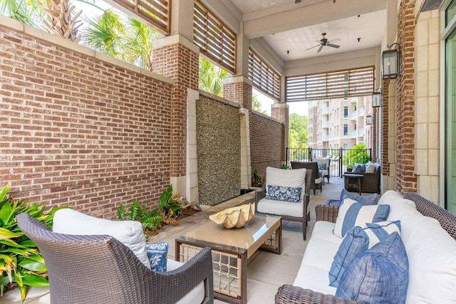 view of patio with outdoor lounge area and ceiling fan