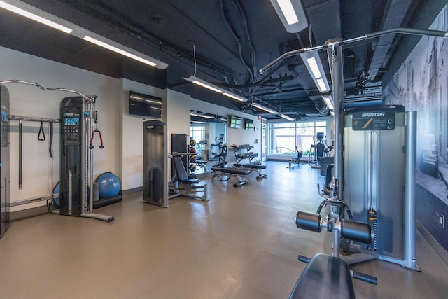 exercise room with baseboards