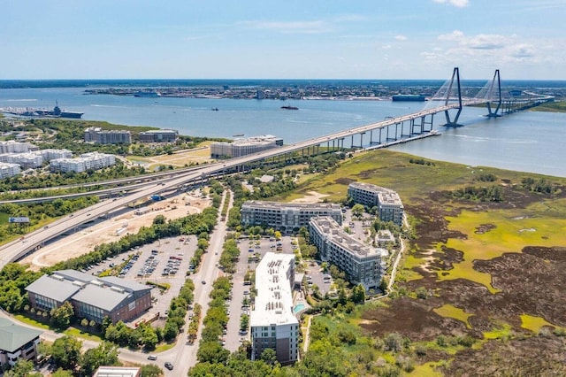 birds eye view of property with a water view and a city view