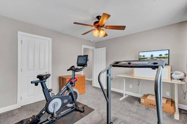 exercise room featuring light carpet and ceiling fan