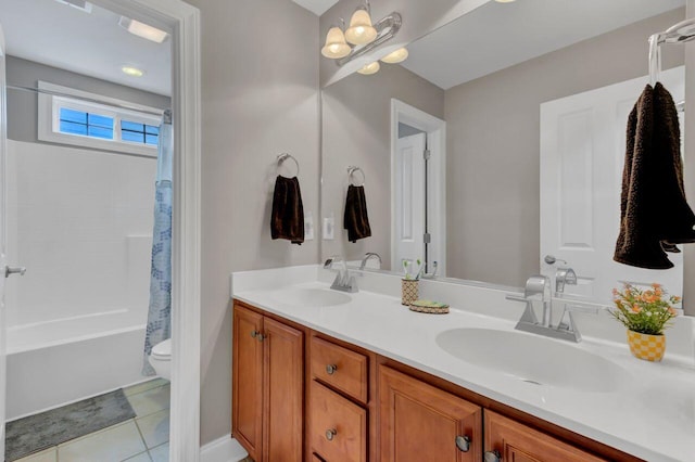 full bathroom with tile patterned floors, vanity, shower / tub combo, and toilet