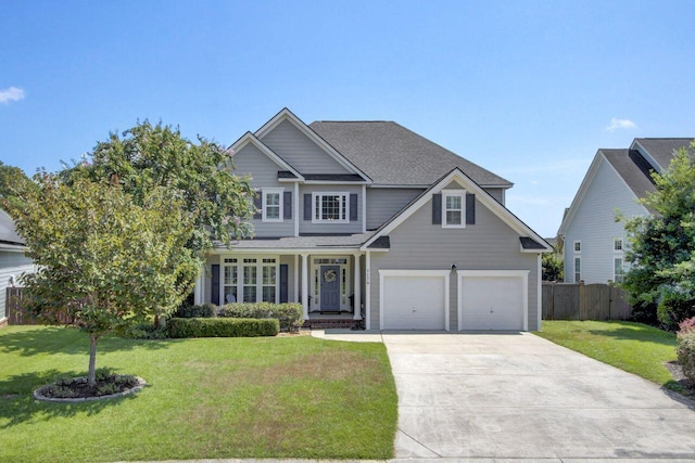 view of front of home featuring a front yard and a garage