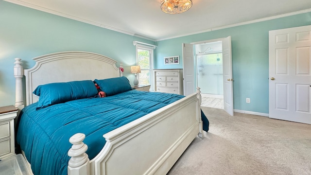 carpeted bedroom with ornamental molding and baseboards