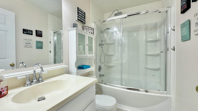 bathroom featuring shower / bath combination with glass door, toilet, and vanity
