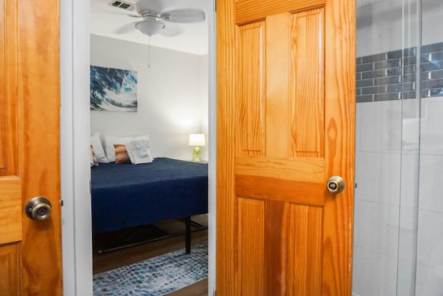 bedroom featuring ceiling fan and visible vents