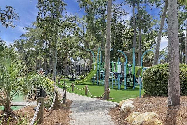 communal playground featuring a lawn