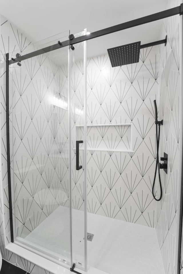 full bath with a shower stall