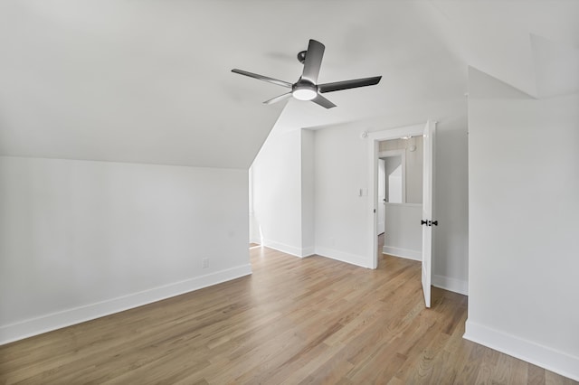 bonus room featuring a ceiling fan, baseboards, vaulted ceiling, and light wood-type flooring